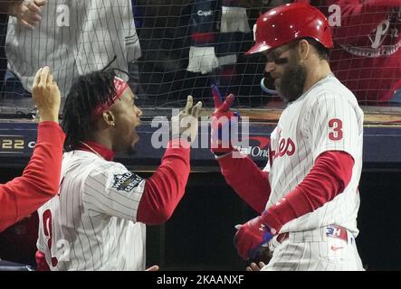 Philadelphia Phillies' Bryce Harper, left, celebrates with teammate Rhys  Hoskins after hitting …