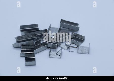 Gray staples on white background Stock Photo