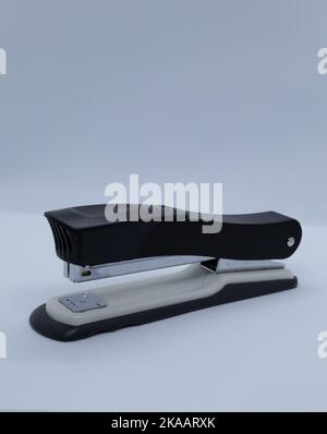 Black stapler with gray on white background Stock Photo