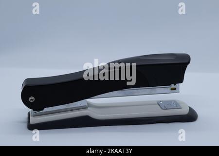 Black stapler with gray on white background Stock Photo