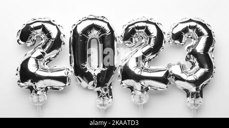 Figure 2023 made of silver balloons on white background Stock Photo