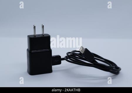 Black charger and cable on white background Stock Photo