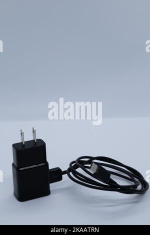 Black charger and cable on white background Stock Photo