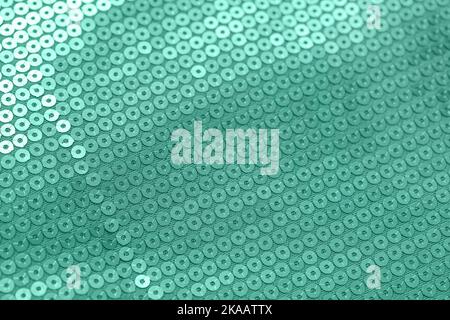 Texture of mint sequin fabric, closeup Stock Photo