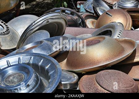 Collection of Antique and Classic Hubcaps in the boiling New Mexico Sun Stock Photo