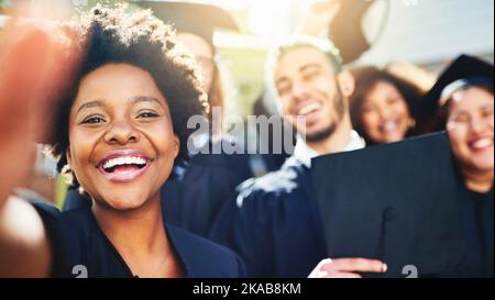 Hard work always pay off. a group of students taking a selfie together. Stock Photo