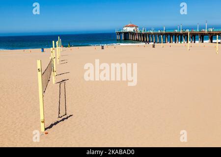 volleyball field at the beach with the pier in background Stock Photo