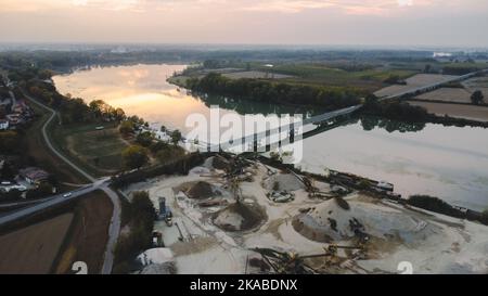 Top view of large manufacturing plant in landscape by the river Po, Piacenza Italy Stock Photo