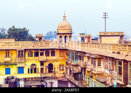 typical houses with roof life in early morning light in old Delhi, India Stock Photo