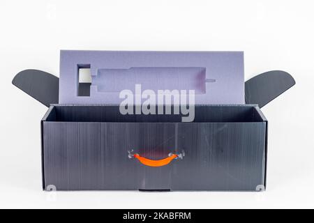empty open grey boy with orange handle Stock Photo