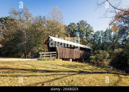 Carrollton, Georgia, USA-Oct. 20, 2022: Shiloh Walking Trail Covered Bridge, built in 1993 from timbers from another old bridge, is located behind the Stock Photo