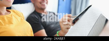 Young bloggers freelancers are working on laptop while lying on bed Stock Photo