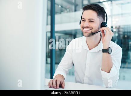 Telemarketing, customer service and call center worker with headset, happy and consulting online with computer. Consultant, customer support and Stock Photo