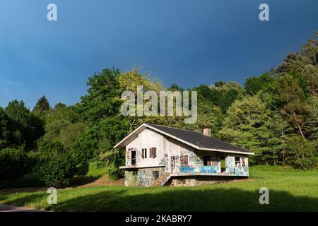 CARBALLINO, SPAIN - MAY 14, 2022: Front picture of an abandoned house in Carballino, Spain, illuminated by the last rays of light before a storm. Stock Photo