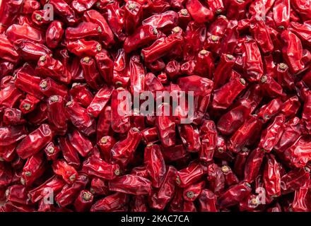 Close up view of dried Berberis vulgaris also known as common barberry, European barberry or barberry on plate in home kicthen. Stock Photo