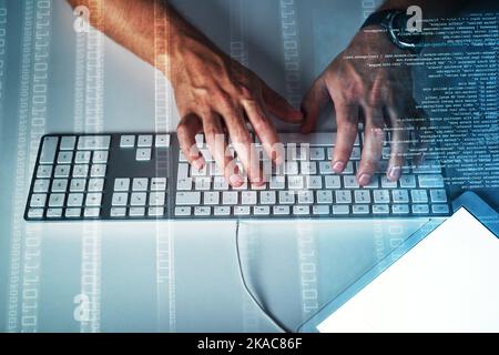 Let your fingers do the typing. High angle closeup of a male programmer typing on a keyboard in the office at work. Stock Photo