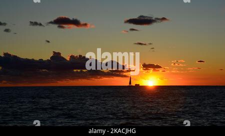 A beautiful sunset on the waterfront of Piran town in Slovenia in mid September Stock Photo