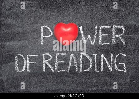 power of reading phrase written on chalkboard with red heart symbol instead of O Stock Photo