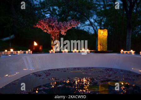 Having relaxing bath in a tub outside in the night Stock Photo