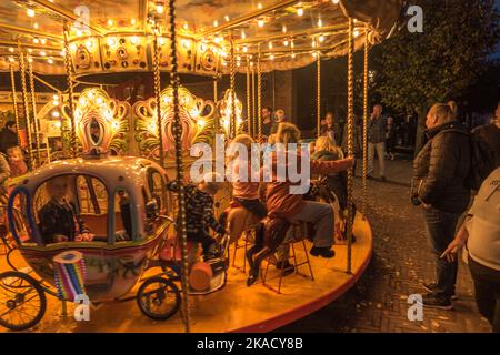 Enkhuizen, Netherlands. October 2022. An old-fashioned carousel with children at a fair in Enkhuizen. High quality photo Stock Photo
