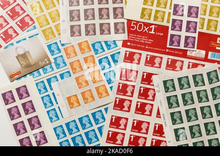 An array of new and unused but old style traditional postage stamps issued by the Royal Mail due for withdrawal from use in January 2023. They all feature a profile portrait of Queen Elizabeth the second, QE2, the late Queen of the UK. (132) Stock Photo