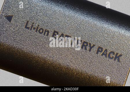 Lithium-ion battery pack in a compact package. Closeup with colored backlight. Stock Photo