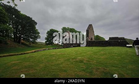 2019 photo - Part of the perimeter wall at St Blane's Church, Isle of Bute, Scotland. Saint Blane or Bláán was an early Scottish  Christian Pictish bishop  who was born at some unknown date on the Isle of Bute. He died 590 AD . His feast day is the  10th August. He is recognised also by the Scottish Episcopal Church, the  Roman Catholic Church and the Eastern Orthodox Church. The double burial ground is said to be for males and females, though other authorities think the upper one was for monks whilst the lower one was for the laity. St Blane is said to be buried in the upper graveyard. Stock Photo