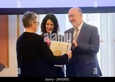 02 November 2022, Berlin: Ron Prosor (r-l), Israel's Ambassador to Germany, and Bettina Jarasch (Bündnis 90/Die Grünen), Berlin Senator for the Environment, Transport, Climate and Consumer Protection, present Anne-Margret Schmid, granddaughter of the Schwartze couple, with the certificate at a ceremony honoring four German 'Righteous Among the Nations' at the Rotes Rathaus. The couples Bruno and Anna Schwartze and posthumously Friedrich and Helene Hübner are honored with the title, with their granddaughters receiving the award in each case. The Israeli Holocaust memorial Yad Vashem has been aw Stock Photo