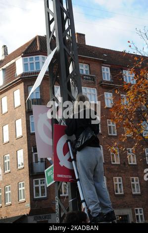 Copenhagen/Denmark/02 November 2022/ Now danish general electuons is over and young  female remove elections campaign playcards in capital.  (Photo. Francis Joseph Dean/Dean Pictures. Stock Photo