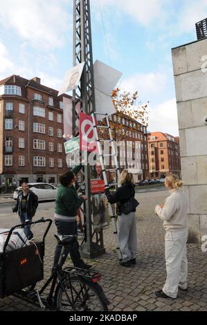 Copenhagen/Denmark/02 November 2022/ Now danish general electuons is over and young  female remove elections campaign playcards in capital.  (Photo. Francis Joseph Dean/Dean Pictures. Stock Photo