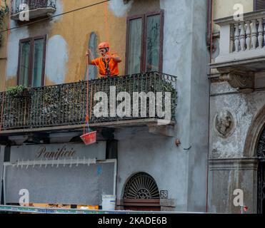 Milan Italy 26 October 2022: Workers at work while renovating an old building Stock Photo