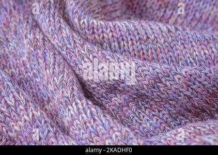 Knit texture of natural soft wool knitted fabric pink pastel melange as background Stock Photo