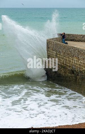 Waves crashing over groyne, seafront, Brighton, England, Great Britain Stock Photo