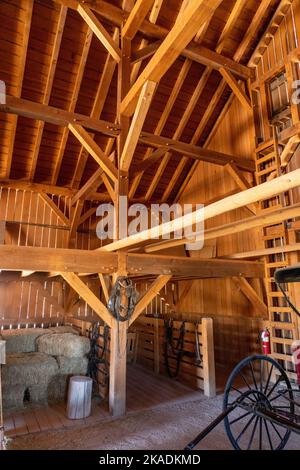 Interior of the reconstructed barn of the pioneer Cove Creek Ranch Fort, built in 1867, Cove Fort, Utah.  Rebuilt using original plans & building tech Stock Photo