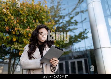 highly successful businessman work remotely with tablet outside Stock Photo