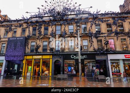 People walking, shopping, on Buchanan St at Princes Square on a damp day, Glasgow, Scotland, UK. Stock Photo