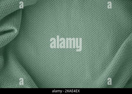 Texture of knitted fabric in trendy turquoise color Stock Photo