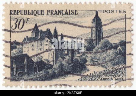 FRANCE - 1963 March 2: An 50 francs black brown postage stamp depicting Abbaye aux Hommes, Caen. The Abbey of Saint-Étienne, also known as Abbaye aux Hommes ('Men's Abbey') by contrast with the Abbaye aux Dames ('Ladies' Abbey'), is a former Benedictine monastery in the French city of Caen, Normandy, dedicated to Saint Stephen. It was founded in 1063[1] by William the Conqueror and is one of the most important Romanesque buildings in Normandy Stock Photo