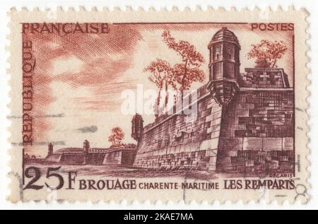 FRANCE - 1955 October 15: An 25 francs orange-brown and red-brown postage stamp depicting a fragment of the fortifications of the Brouage citadel (Charente-Maritime). Brouage was founded in 1555 by Jacques de Pons on the Bay of Biscay facing the Atlantic Ocean. The town was founded on swampy land which had previously been underwater. Its name, 'Brouage', comes from the surrounding mixture of water and clay, which was called 'broue'. The town was fortified between 1630 and 1640 by Cardinal Richelieu as a Catholic bastion in order to fight against the neighbouring Protestant town of La Rochelle Stock Photo