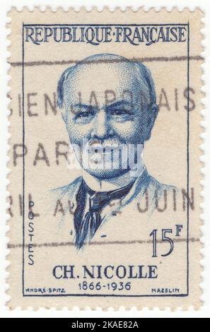 FRANCE - 1958  January 25: An 15 francs deep blue postage stamp depicting portrait of Charles Nicolle (Charles Jules Henri Nicolle). He was a French bacteriologist who received the Nobel Prize in Medicine for his identification of lice as the transmitter of epidemic typhus Stock Photo