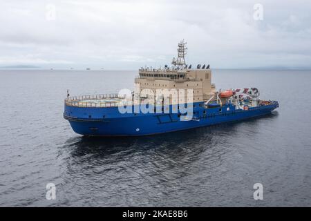 The ice breaker with a platform for helicopter landing, in the middle of a gulf. Stock Photo