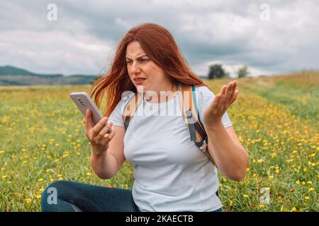 No connection on the mountain. Searching for mobile connection in wild nature on vacation. Perfect day outdoor. No communication Stock Photo