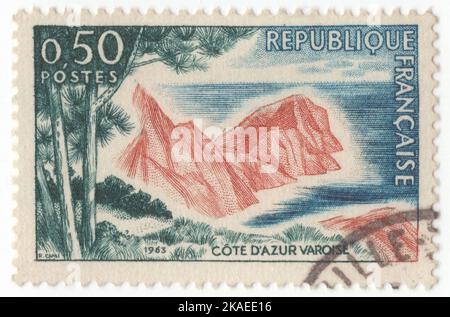 FRANCE - 1963 June 15: An 50 centimes dark green, dark blue and henna-brown postage stamp depicting Cote d’Azur Varoise, is the French Riviera, the Mediterranean coastline of the southeast corner of France. This coastline was one of the first modern resort areas. It began as a winter health resort for the British upper class at the end of the 18th century. With the arrival of the railway in the mid-19th century, it became the playground and vacation spot of British, Russian, and other aristocrats, such as Queen Victoria, Tsar Alexander II and King Edward VII, when he was Prince of Wales Stock Photo