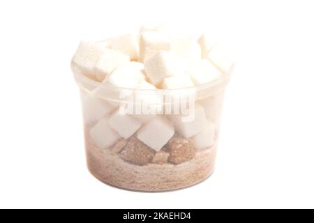 Cube of brown and white sugar in a plastic box isolated on white background. Stock Photo