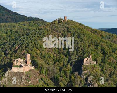 AERIAL VIEW. The three Castles of Ribeauvillé with (left to right) St-Ulrich, Haut-Ribeaupierre and Girsberg. Haut-Rhin, Alsace, Grand Est, France. Stock Photo