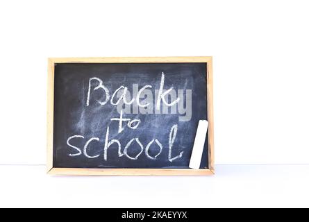 Back to school background. Words on the white lightbox. Stock Photo