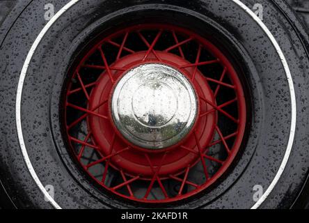 spare tire on vintage car on a rainy day Stock Photo