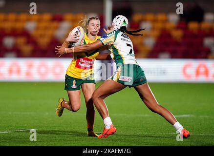 Australia’s Tarryn Aiken is tackled by Cook Islands’ Chantay Kiria-Ratu during the Women's Rugby League World Cup group B match at the LNER Community Stadium, York. Picture date: Wednesday November 2, 2022. Stock Photo