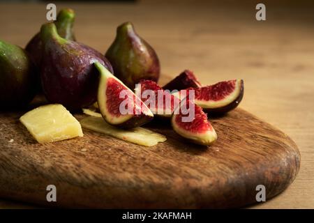 sliced figs on a wooden board Stock Photo