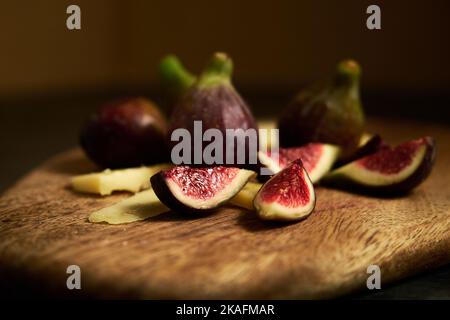 sliced figs on a wooden board Stock Photo